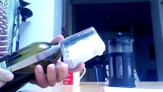 Remove BottleLox security device from bottle using a kitchen knife [upl. by Borszcz]