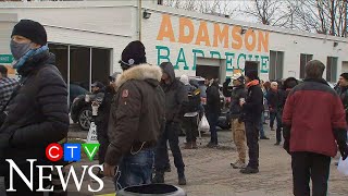 A Toronto restaurant defies lockdown orders and then police arrive [upl. by Kellyn204]