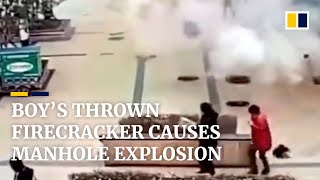 Boy in China throws firecracker into manhole causing explosion [upl. by Howland]